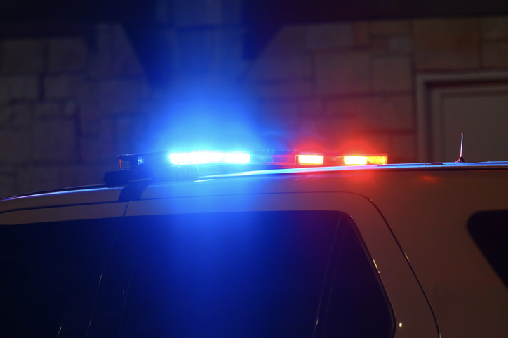 Police interceptor vehicle with overhead light bar illuminated for a traffic stop