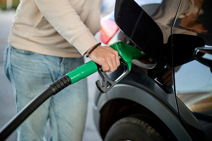 man filling his car with gas