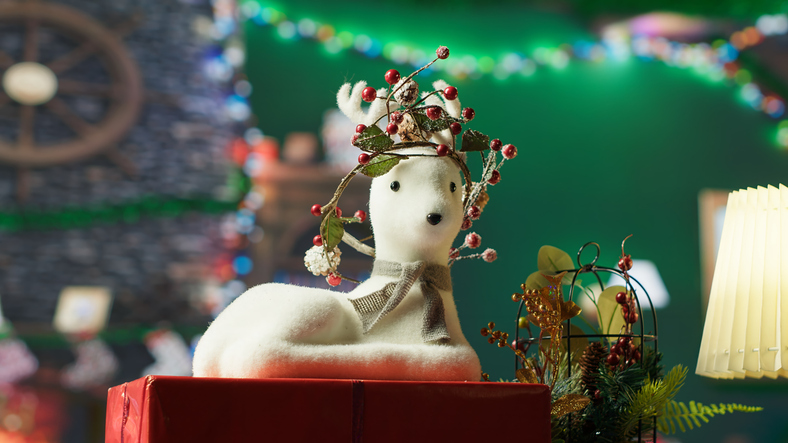 Empty cozy log cabin decorated with festive garlands and ornaments
