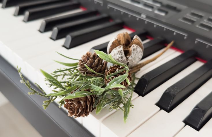 black and white piano with Christmas Decorations