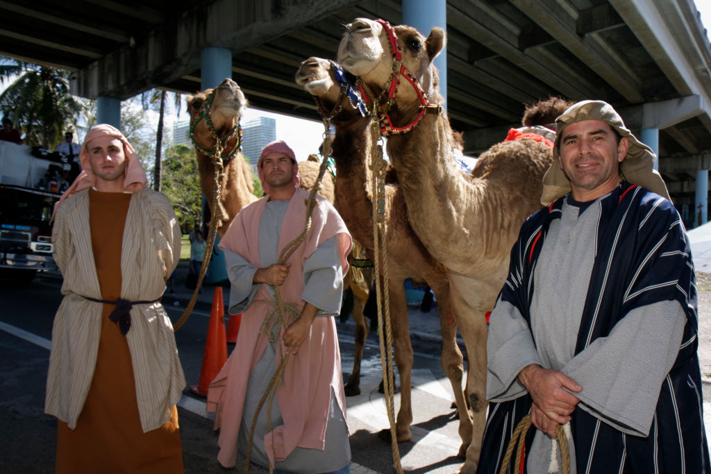 Men in costume at the Three Kings Day Parade