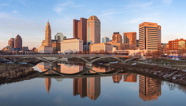 Columbus Ohio downtown skyline as seen from the banks of the Scioto River on a late winter evening