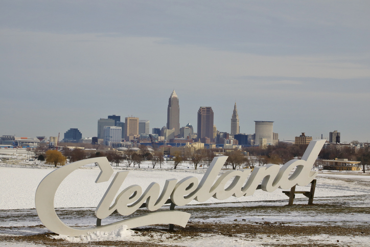Cleveland Script tourist sign in front of the city skyline at winter season