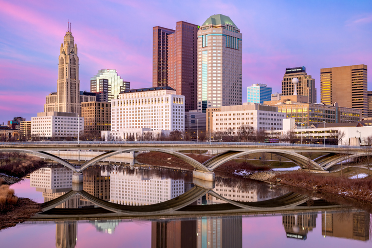 Columbus Ohio downtown skyline as seen from the banks of the Scioto River on a late winter evening