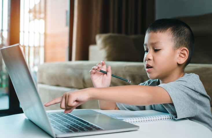 Technology studying at home using laptop computer, Student distance learning virtual distance online class on video call virtual lesson, Parent or tutor teaching child boy with remote education.