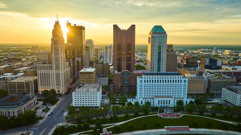 Aerial sunrise with sun visible in heart of downtown Columbus Ohio