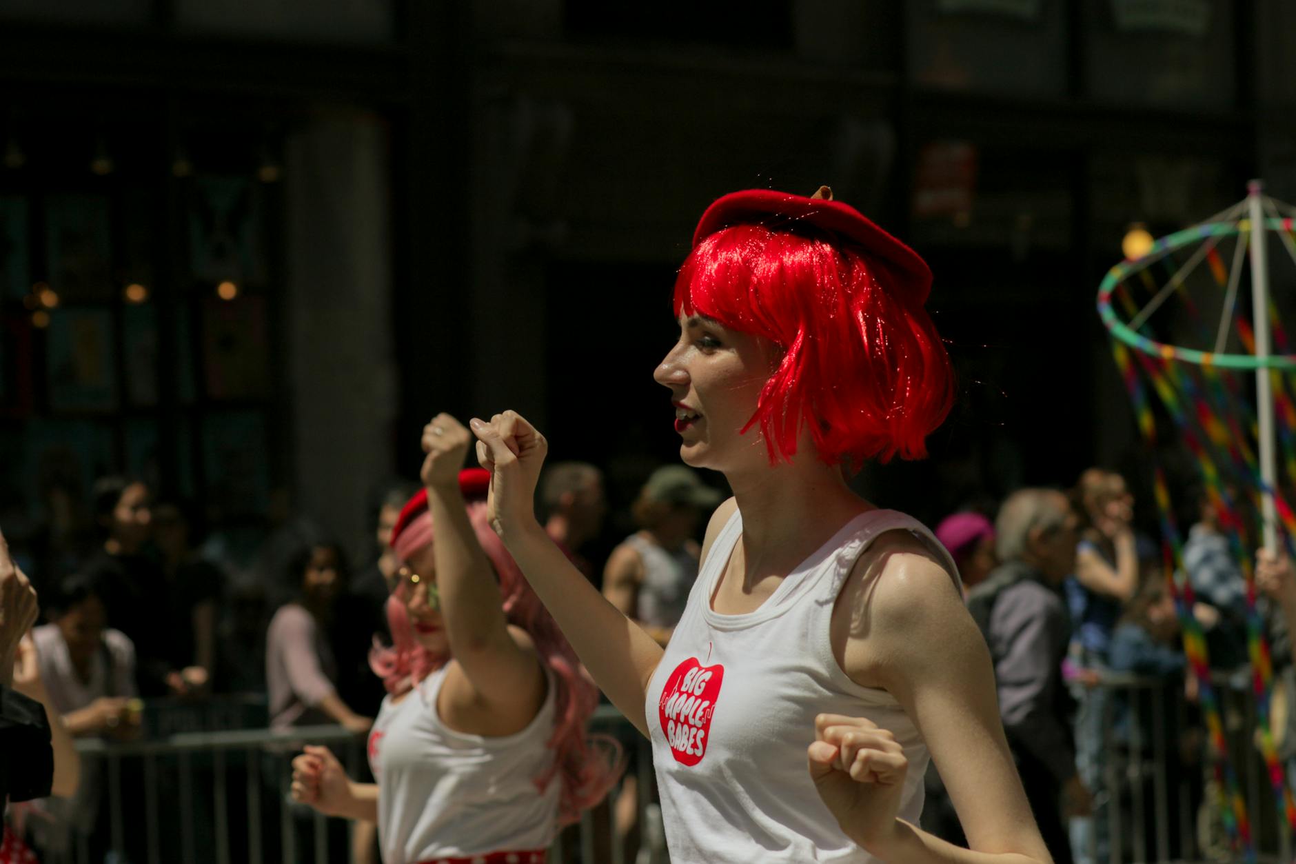 woman in white tank top with red hair