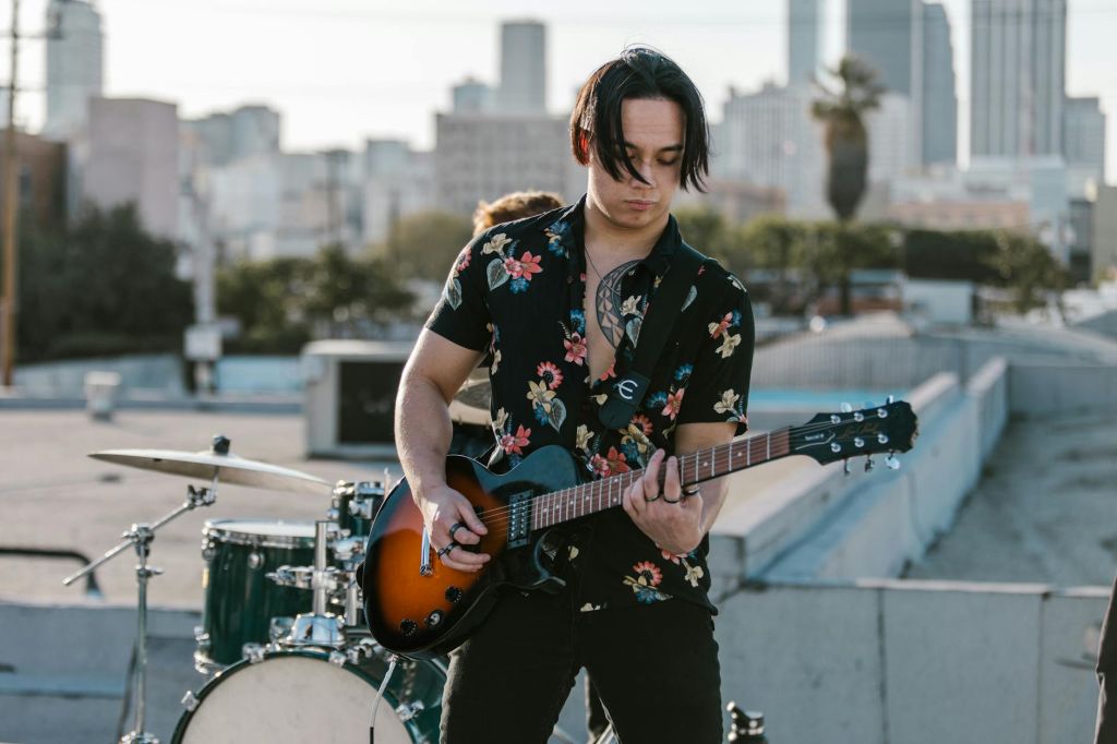 a man playing the electric guitar