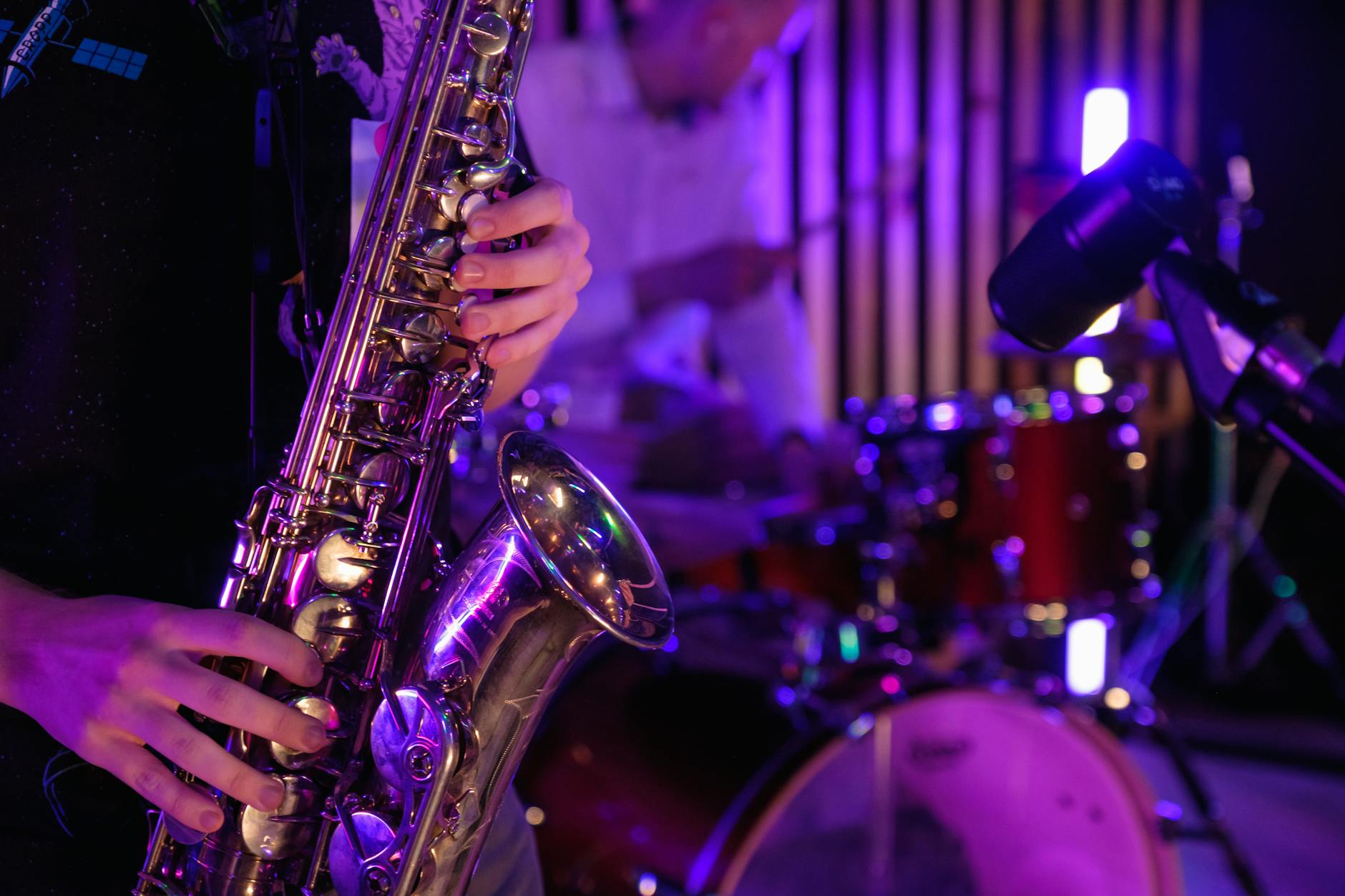 close up photo of man playing saxophone