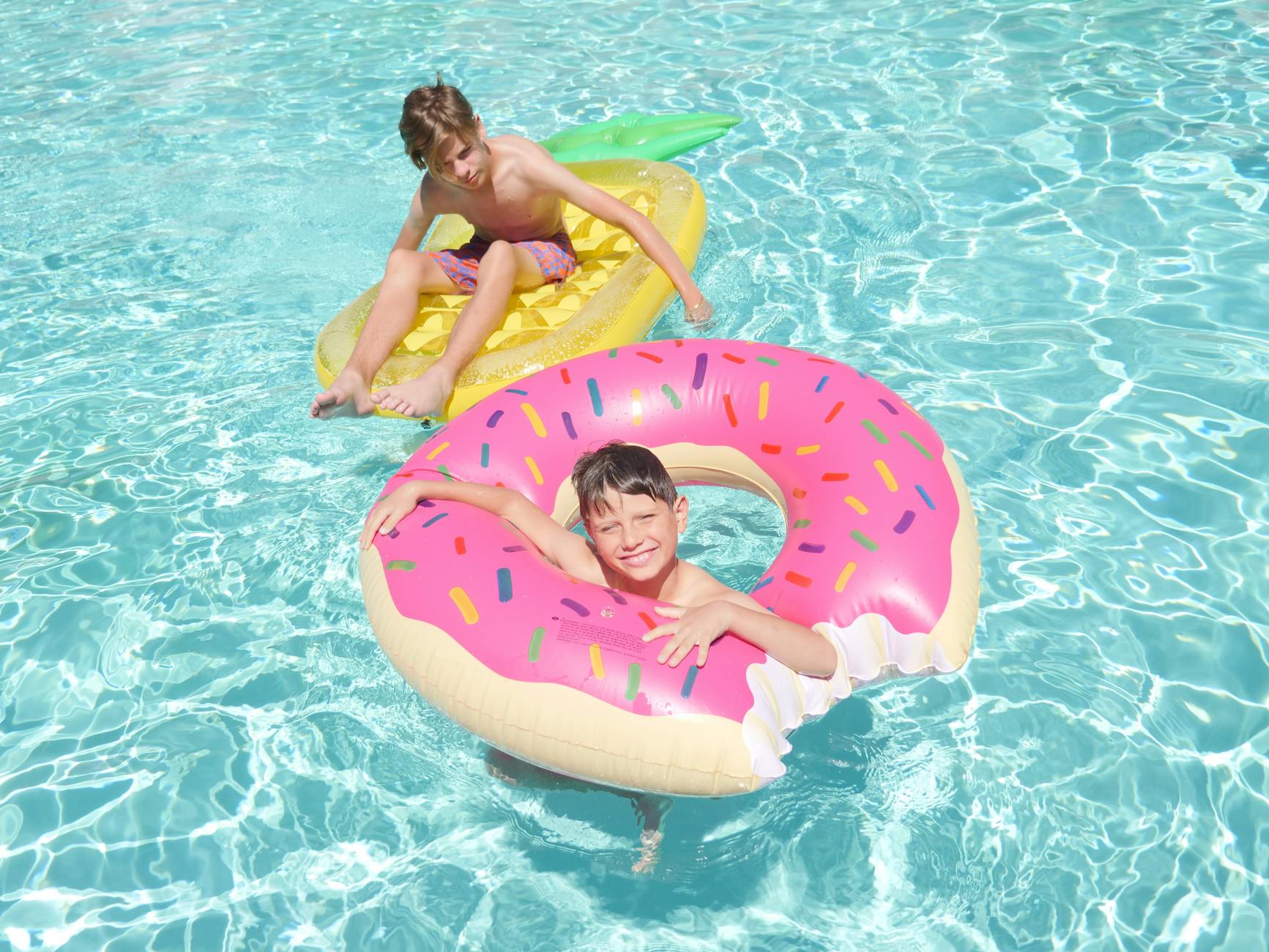 boys swimming in the pool