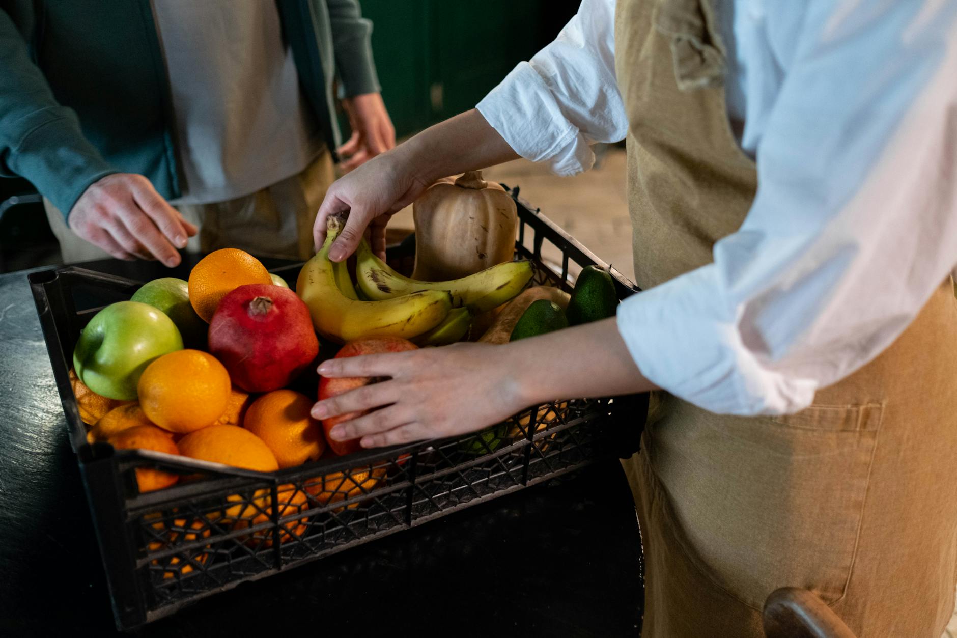 person holding fruits