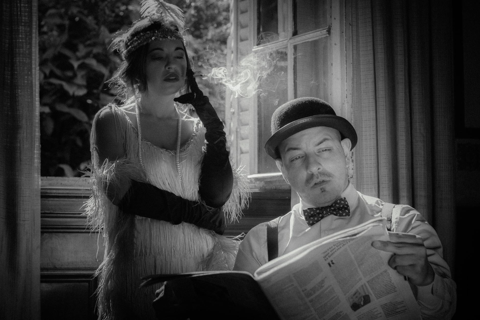 man in hat and woman in flapper dress