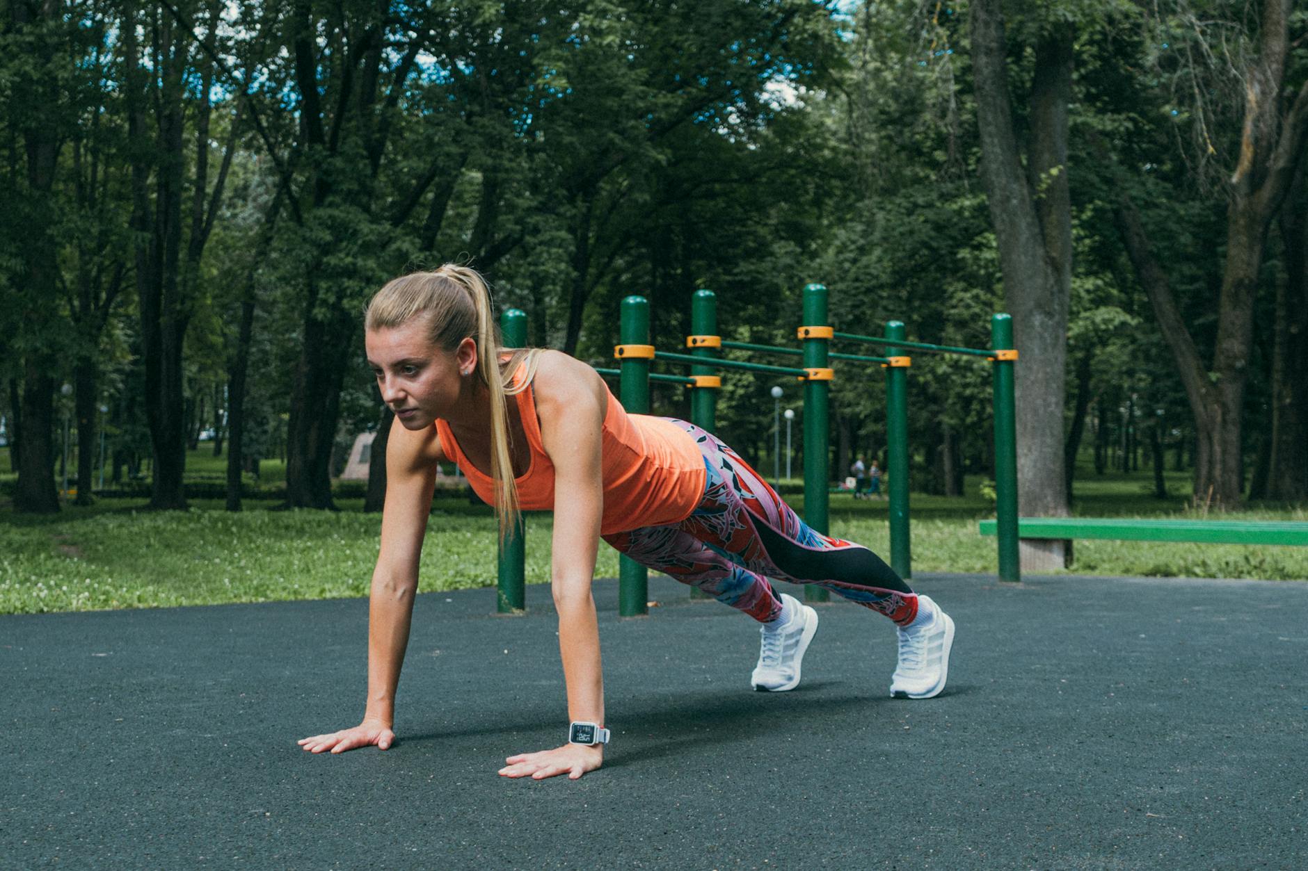 a woman exercising in the park playground
