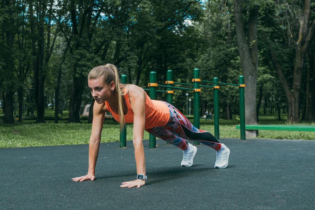 a woman exercising in the park playground