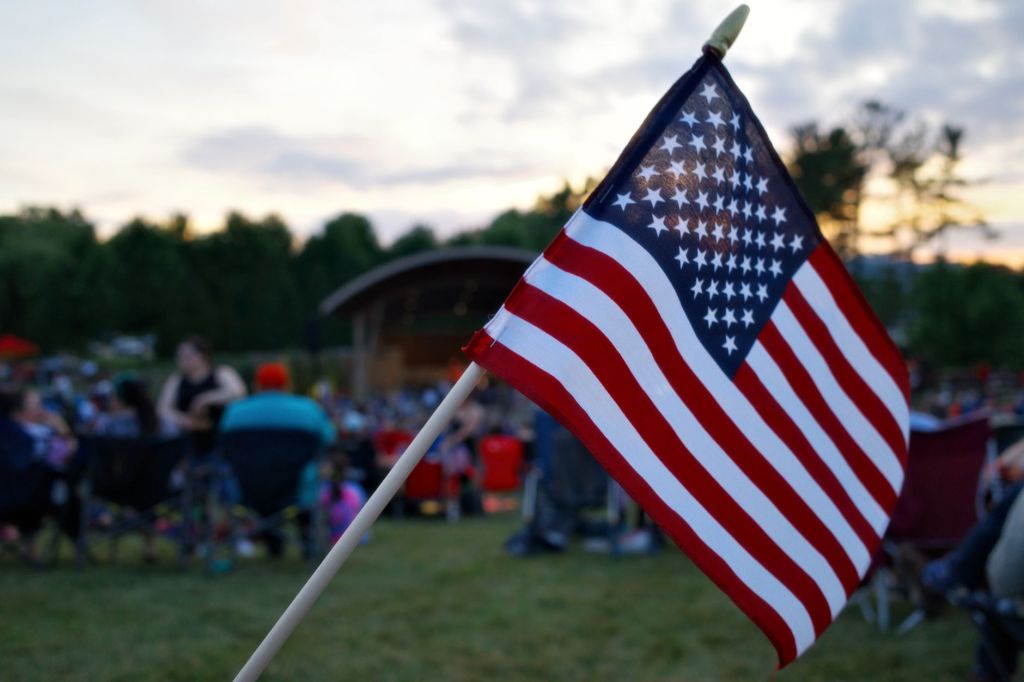 american flag waving at outdoor festival