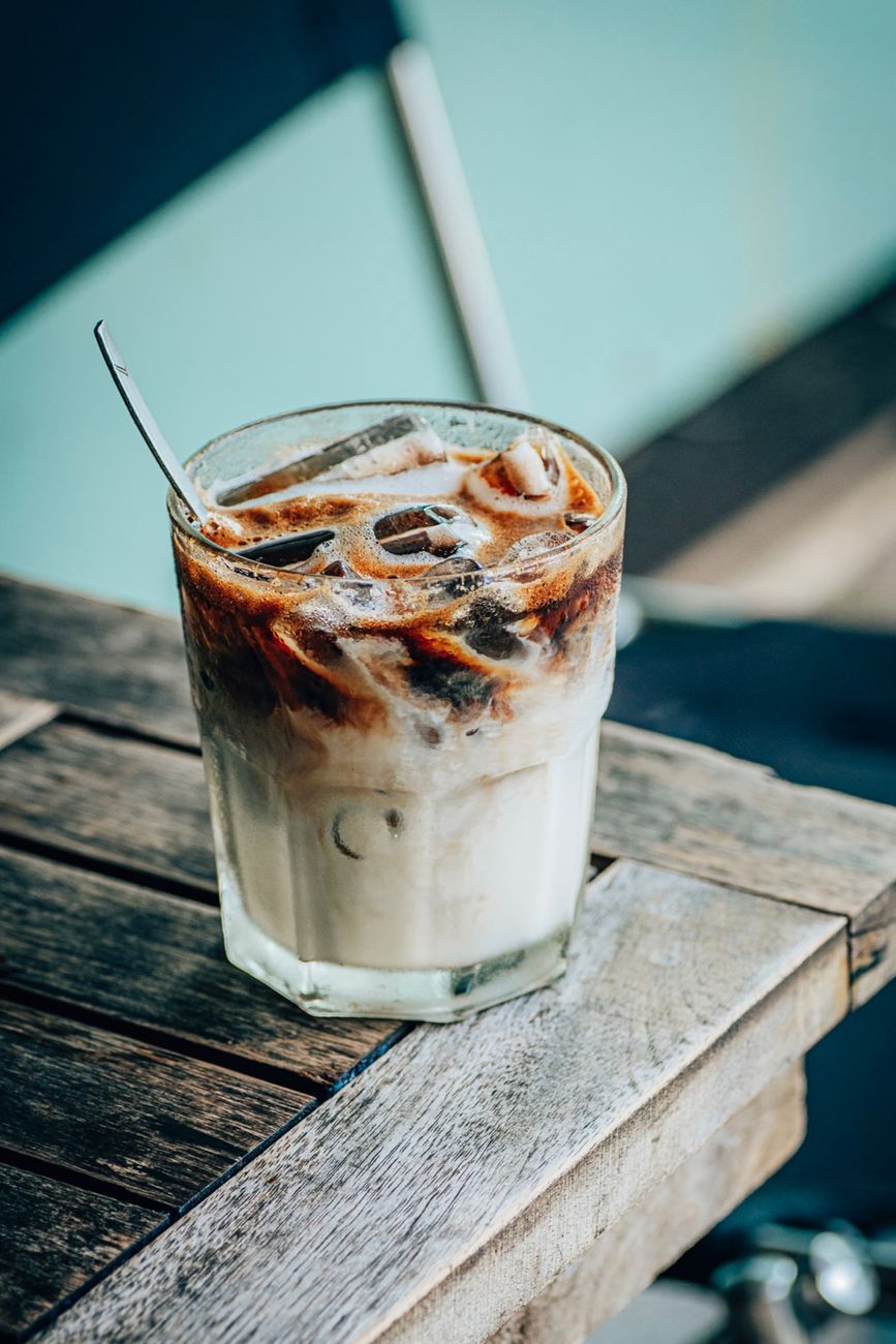 refreshing iced coffee on rustic wooden table