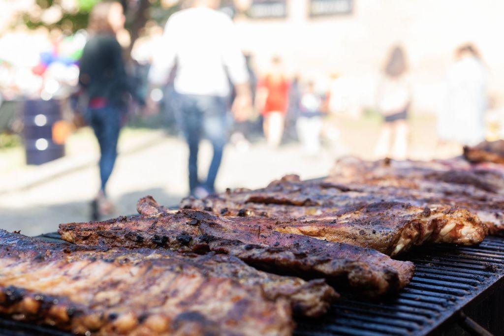 a baby back ribs cooking on the grill