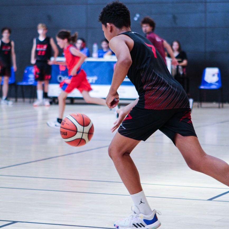 a boy playing basketball