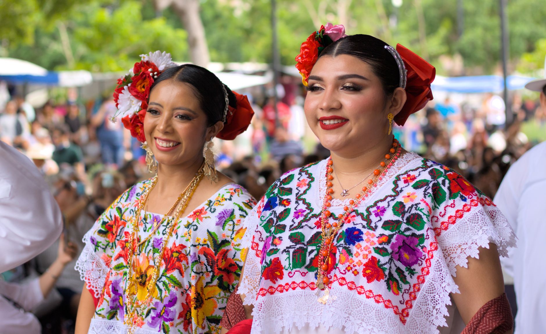 women in traditional yucatecan dress at cultural festival