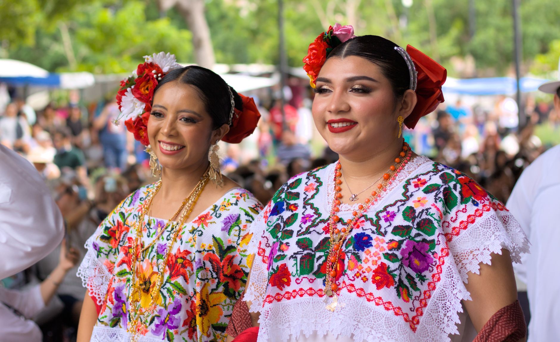 women in traditional yucatecan dress at cultural festival